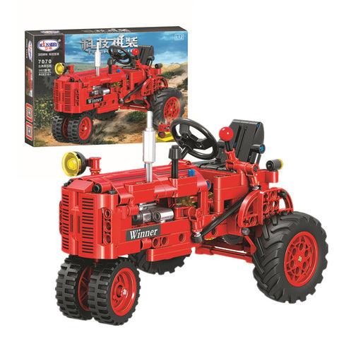 Red vintage-style toy tractor model enhancing block play and attention span for children.