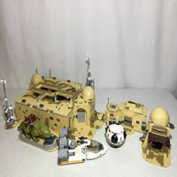 Thumbnail for Desert-themed LEGO Star Wars Mos Eisley Cantina playset with buildings and vehicles