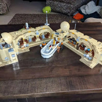 Thumbnail for LEGO Star Wars Mos Eisley Cantina set showcased on wooden surface with building blocks